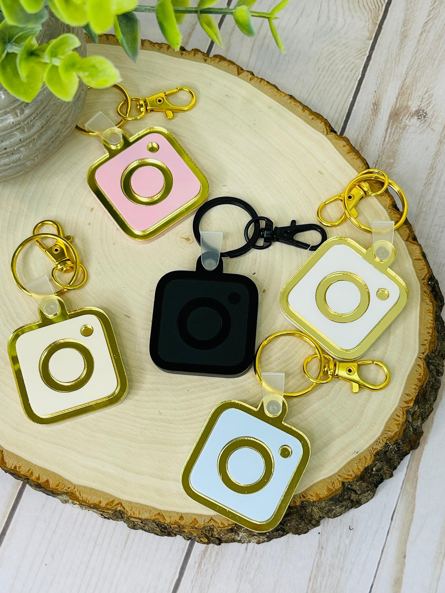 A collection of NFC keychains in various colors, including black, gold, silver, and pastel shades, showcasing customizable options for every style.