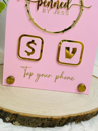 Pink acrylic business sign with gold 3D logo, Venmo & Cash App icons, and "Tap your phone" text on a gold nail base. Perfect for small businesses and vendors - close up view