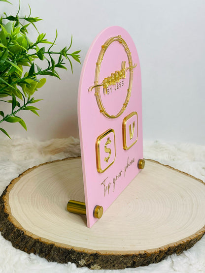 Pink acrylic business sign with gold 3D logo, Venmo & Cash App icons, and "Tap your phone" text on a gold nail base. Perfect for small businesses and vendors. - side view